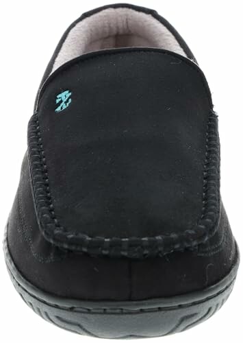 Front view of a black suede slipper with stitching detail.