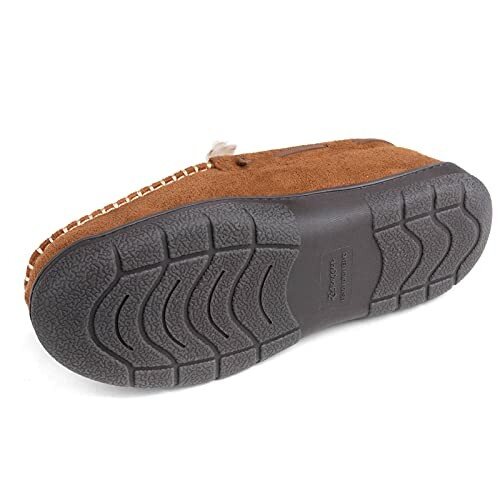 Sole of a brown moccasin slipper with textured grip, providing traction and stability