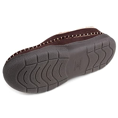 Bottom view of a brown slipper with a textured rubber sole.
