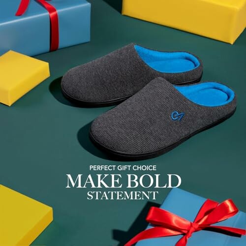 Comfortable gray slippers with gift boxes on a green background.